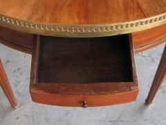 A French Louis XVI style mahogany bouillotte table with inset marble top - 701848