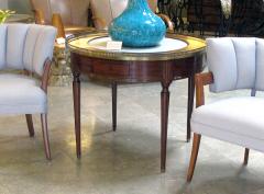 A French Louis XVI style mahogany bouillotte table with inset marble top - 701850