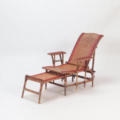 A French rattan Chaise Longue with orange and red stripes circa 1900  - 2835760