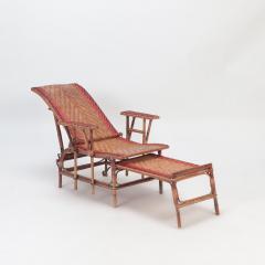 A French rattan Chaise Longue with orange and red stripes circa 1900  - 2835761