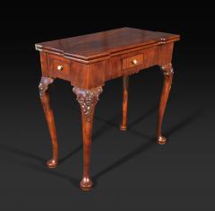 A GEORGE II MAHOGANY GAMES TABLE - 2771726