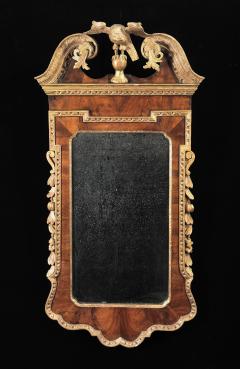 A GEORGE II WALNUT AND PARCEL GILT MIRROR - 1641908