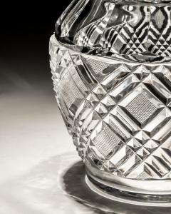 A HEAVILY CUT GLASS CREAM JUG - 4340915