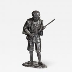 A Meiji period bronze of a huntsman carrying a gun - 1001639