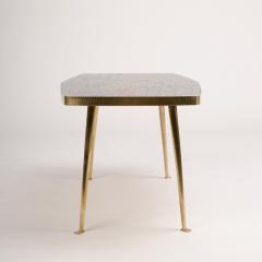 A Mid Century German coffee table with a mosaic top on brass metal legs - 1697326