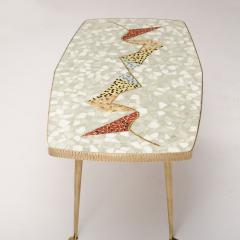 A Mid Century German coffee table with mosaic top on tapered brass legs - 1697312