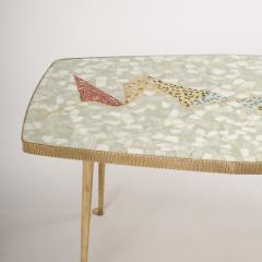 A Mid Century German coffee table with mosaic top on tapered brass legs - 1697314