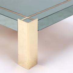 A Mid Century Modern coffee table with brass legs and trim Circa 1970 - 2348623