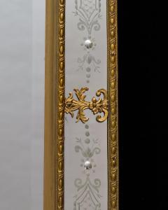 A NEAR PAIR OF VICTORIAN PERIOD ORMOLU MOUNTED ENGRAVED MIRRORS - 3796000