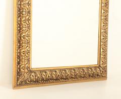A Nineteenth Century continental relief and gilt carved mirror  - 3477156