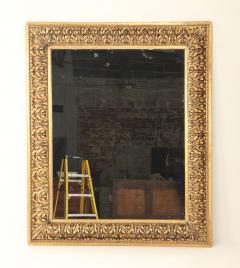 A Nineteenth Century continental relief and gilt carved mirror  - 3477157