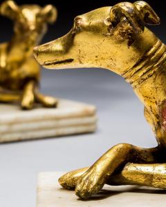 A PAIR OF GILT WOOD GREYHOUND CANDLESTICKS - 4424937