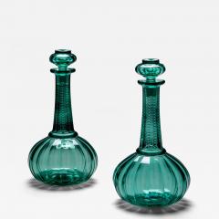 A PAIR OF GREEN SHAFT GLOBE DECANTERS - 4583604