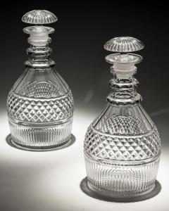 A PAIR OF REGENCY SLICE FLUTE DECANTERS WITH DIAMOND CUT BAND - 3793701
