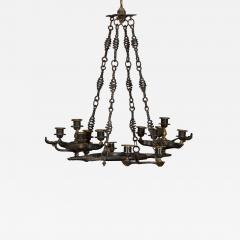 A PATINATED BRONZE FOURTEEN LIGHT CHANDELIER IN THE ANCIENT ROMAN TASTE - 3917425