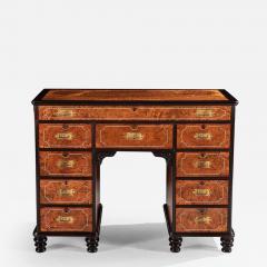 A RARE CHINESE EXPORT AMBOYNA AND EBONY CAMPAIGN KNEEHOLE DESK - 2544850