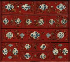 A RED LACQUERED CABINET WITH SHAPED PANELS - 3424386