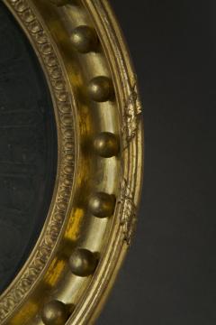 A Regency oval wall mirror cum light reflector with decorative scalloped design - 4518331