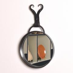 A Round Steel Mirror - 3874554