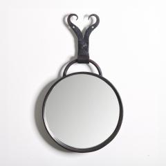 A Round Steel Mirror - 3874555