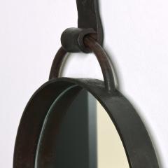 A Round Steel Mirror - 3874556