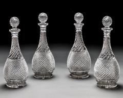 A SET OF FOUR DIAMOND SWIRL CUT DECANTERS WITH CORRESPONDING WINE EWER - 3787812