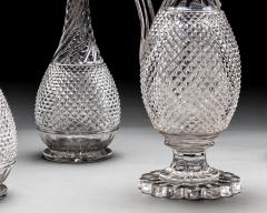 A SET OF FOUR DIAMOND SWIRL CUT DECANTERS WITH CORRESPONDING WINE EWER - 3787829