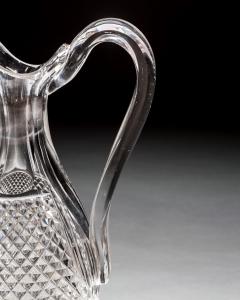 A SET OF FOUR DIAMOND SWIRL CUT DECANTERS WITH CORRESPONDING WINE EWER - 3787859