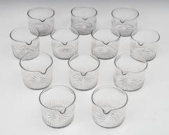 A SET OF TWELVE FLUTE CUT FINGER BOWLS WITH A STAR CUT BASE - 3960378