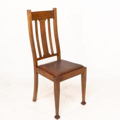 A Set of Four Arts Crafts Oak Dining Chairs with Comfortable Shaped Backs - 4192493
