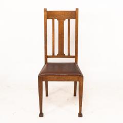 A Set of Four Arts Crafts Oak Dining Chairs with Comfortable Shaped Backs - 4192494