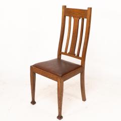 A Set of Four Arts Crafts Oak Dining Chairs with Comfortable Shaped Backs - 4192495