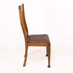 A Set of Four Arts Crafts Oak Dining Chairs with Comfortable Shaped Backs - 4192496