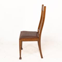 A Set of Four Arts Crafts Oak Dining Chairs with Comfortable Shaped Backs - 4192497