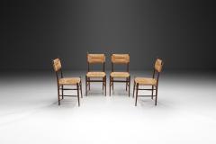 A Set of Four Dining Chairs with Woven Straw Seats and Backs Europe ca 1950s - 3458581
