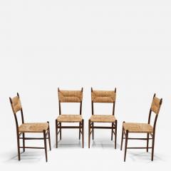 A Set of Four Dining Chairs with Woven Straw Seats and Backs Europe ca 1950s - 3459983