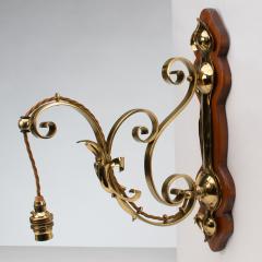 A Set of Three Arts Crafts Brass Wall Lights with Walnut Backplates - 4192506