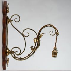 A Set of Three Arts Crafts Brass Wall Lights with Walnut Backplates - 4192508