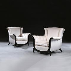 A UNUSUAL PAIR OF FRENCH ART DECO EBONISED ARMCHAIRS IN A CRUSHED VELVET - 2152610