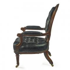 A Victorian rosewood medallion backed open arm chair by Holland Sons - 3081052