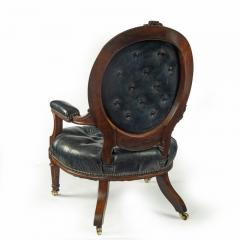 A Victorian rosewood medallion backed open arm chair by Holland Sons - 3081053