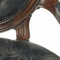 A Victorian rosewood medallion backed open arm chair by Holland Sons - 3081057
