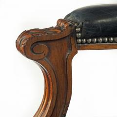 A Victorian rosewood medallion backed open arm chair by Holland Sons - 3081062