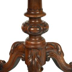 A Victorian walnut revolving display table - 2846723