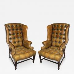 A Vintage Pair of Tufted Leather Wing Chairs - 3302316