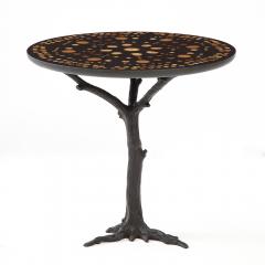 A contemporary round side table Patinated Iron base with a unique art piece top - 2033391