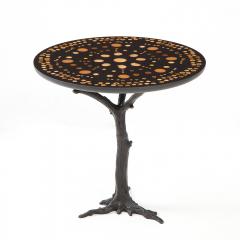 A contemporary round side table Patinated Iron base with a unique art piece top - 2033393