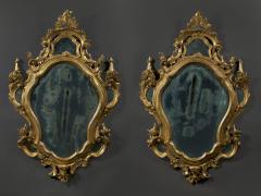 A fine pair of barocchetto escutcheon shaped giltwood mirrors cum girandoles - 4518321