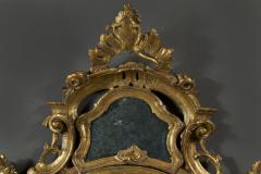 A fine pair of barocchetto escutcheon shaped giltwood mirrors cum girandoles - 4518324
