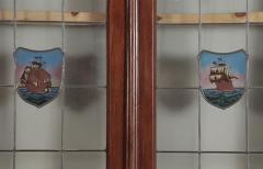 A four panel mahogany window set in frame with leaded glass having ship motif  - 3696129